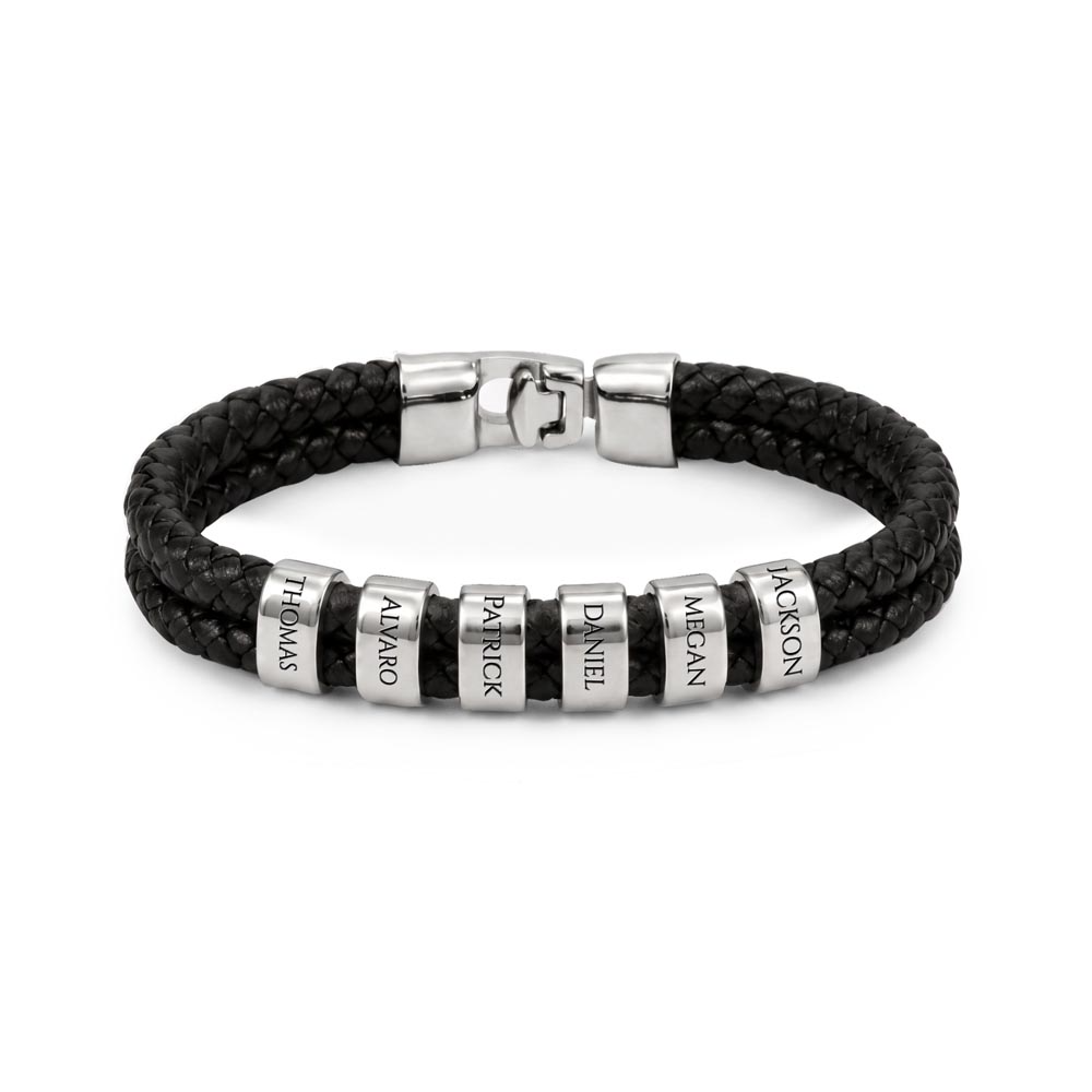 Close-up of black braided vegan leather men's name bracelet with custom engraved central bead.