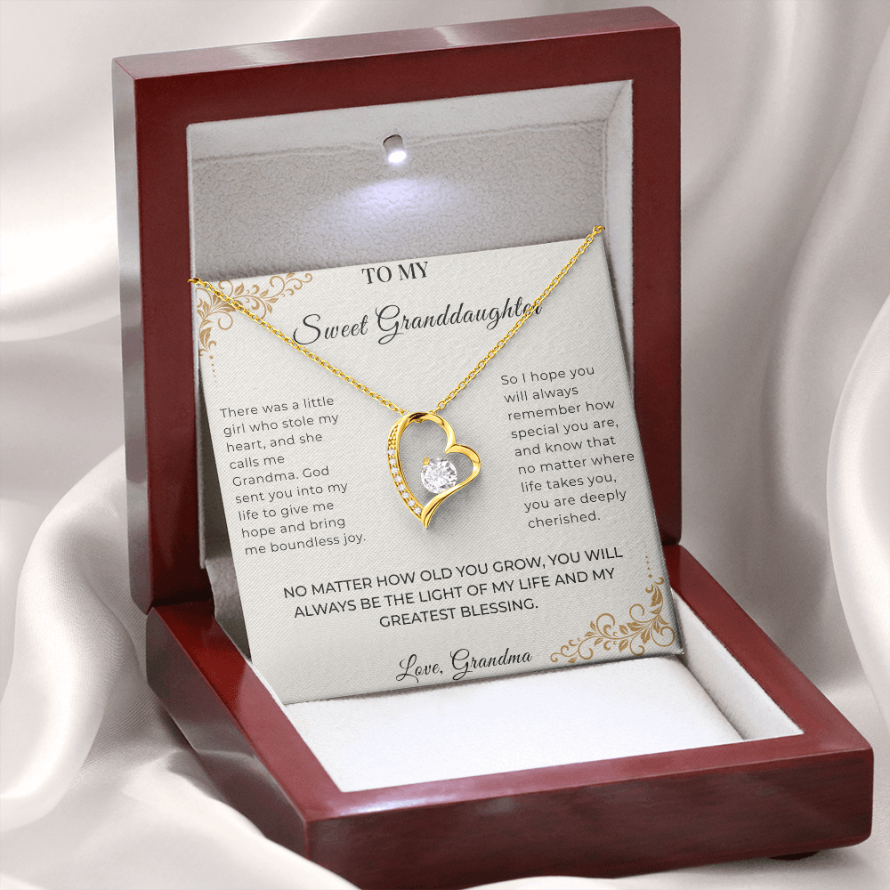 Open gift box displaying Written Affection granddaughter keepsake jewelry and Grandpa message card