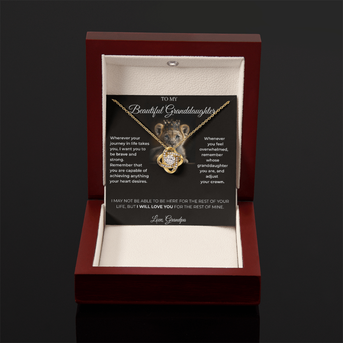 Open luxury gift box displaying the Written Affection granddaughter keepsake necklace and lion crown card
