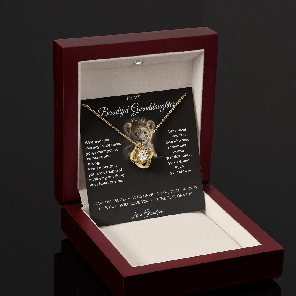 Open luxury gift box displaying the Written Affection granddaughter keepsake necklace and lion crown card