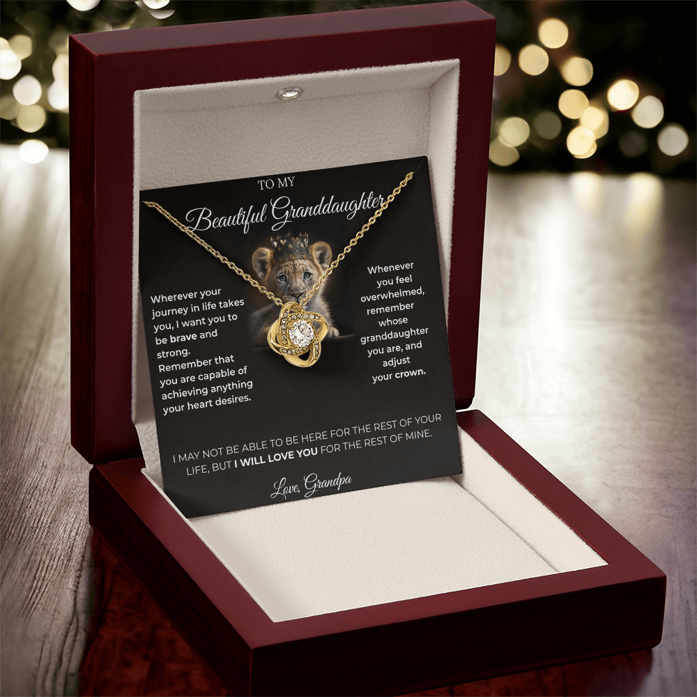 Open luxury gift box displaying the Written Affection granddaughter keepsake necklace and lion crown card