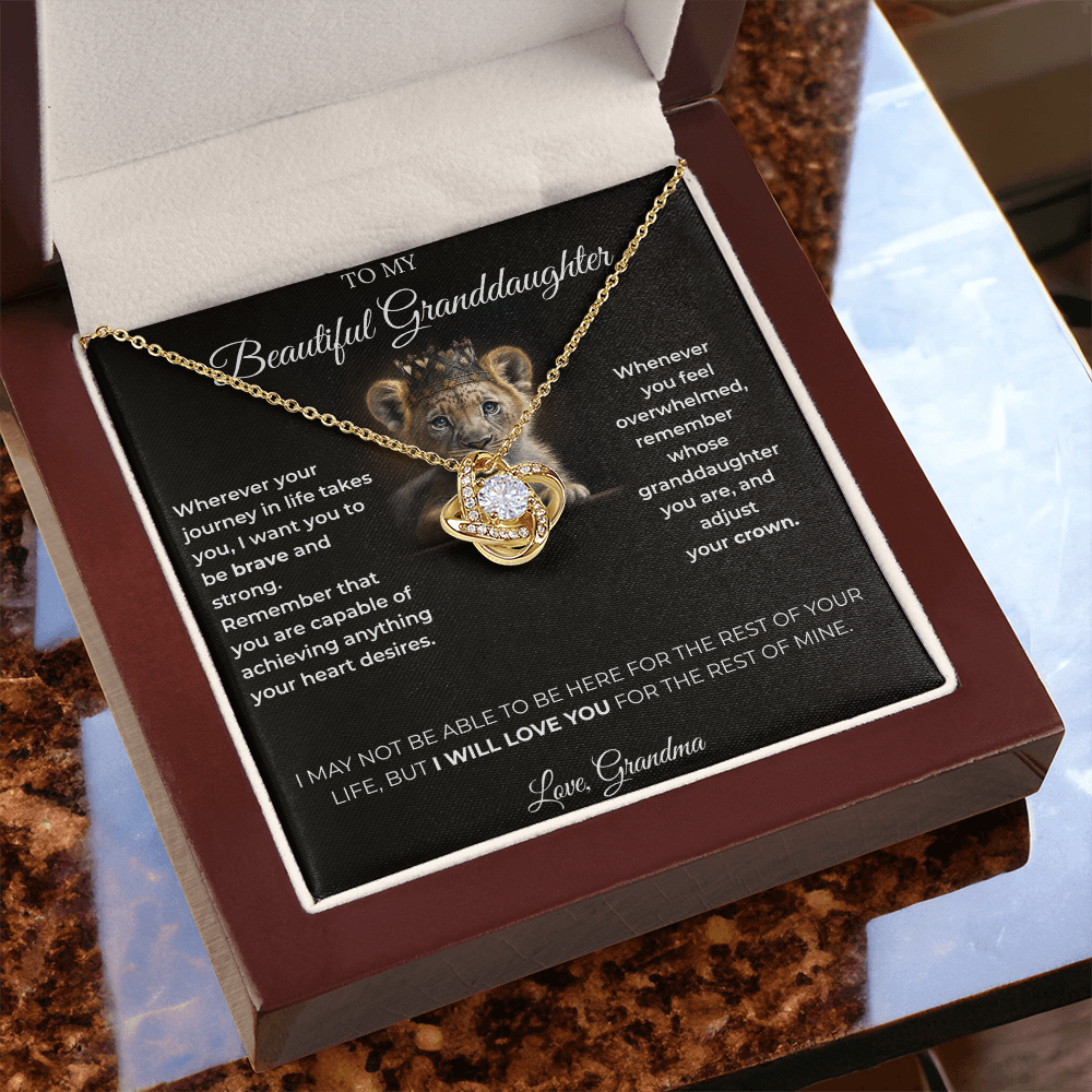 Open luxury gift box displaying the Written Affection granddaughter keepsake necklace and lion crown card