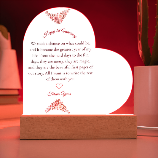 Heart shaped clear acrylic 1st anniversary gift for wife on a glowing purple LED wooden base