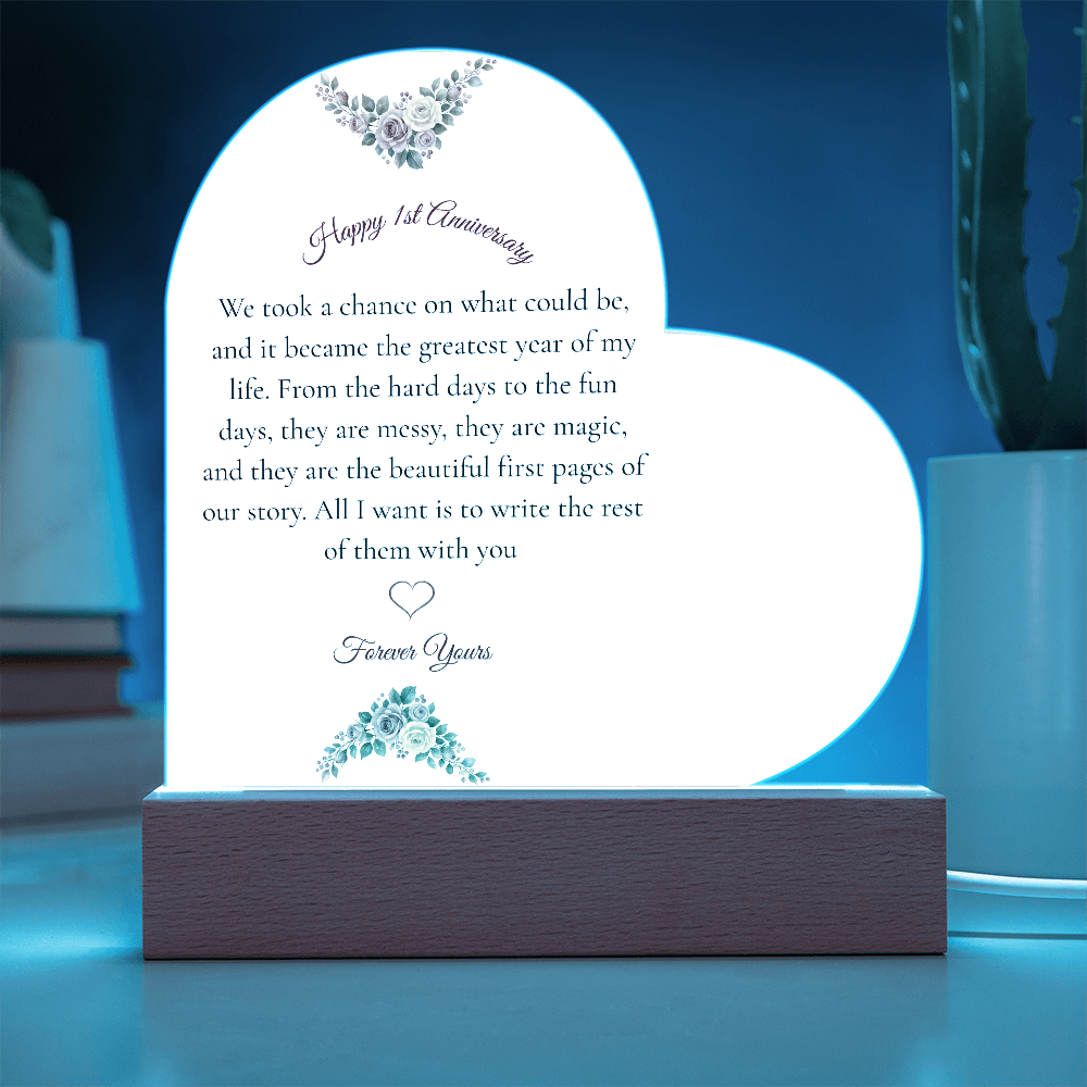 Heart shaped clear acrylic 1st anniversary gift for wife on a glowing purple LED wooden base