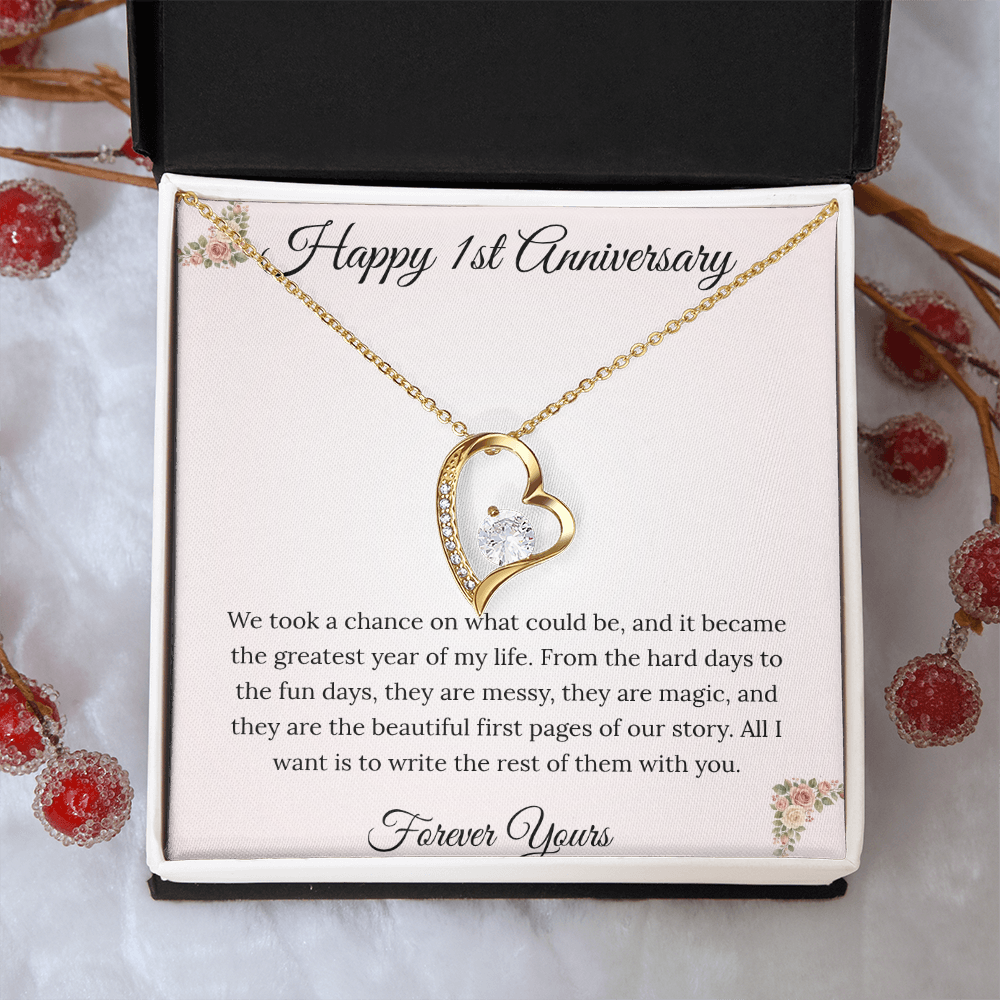 1st Anniversary gift for wife featuring a Forever Love heart necklace inside a luxury mahogany LED box. The pendant rests on a soft blush message card with blue floral corners and a romantic "messy and magic" quote