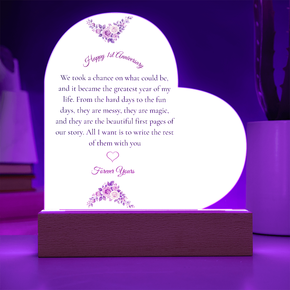 Heart shaped clear acrylic 1st anniversary gift for wife on a glowing purple LED wooden base